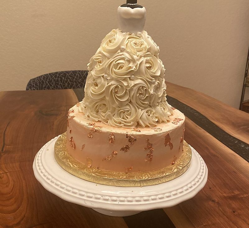 Ruffled rosette dress cake on a sculpted cake base