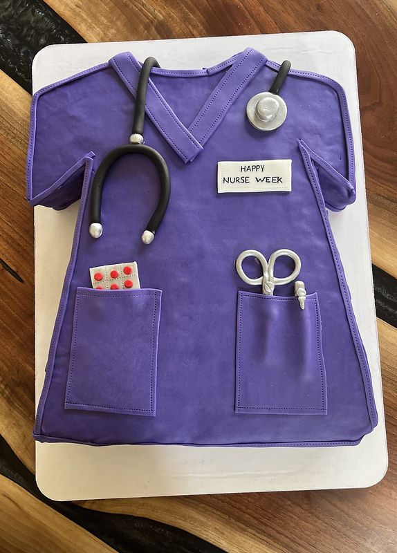 Purple scrubs cake with fondant stethoscope and scissors for nurses week